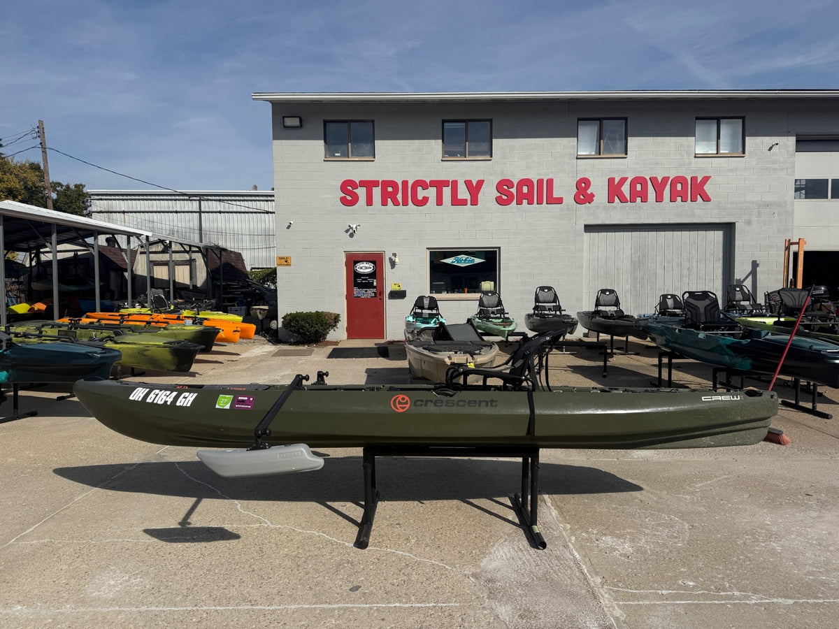 Used Crescent Crew III kayak in front of Strictly Sail & Kayak